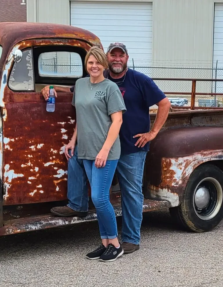Donald Black and Rickie Maples, founders of Pop's Events, smiling at a small-town Missouri festival, embodying community pride and Americana spirit